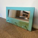 Hall mirror with pegs