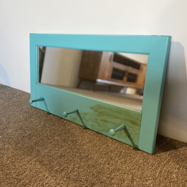 Hall mirror with pegs